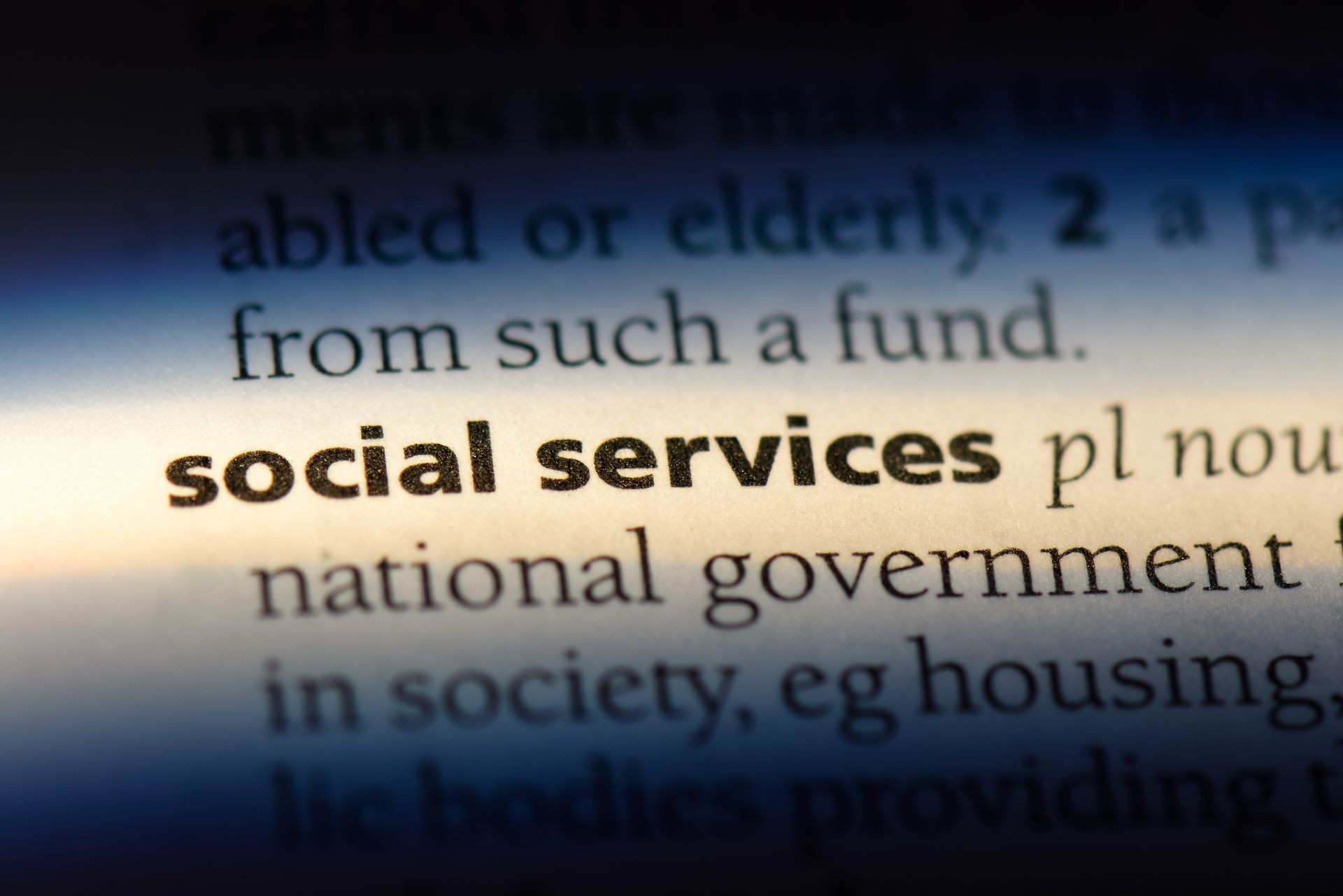 social services word in a dictionary. social services concept. social services word in a dictionary. social services concept.